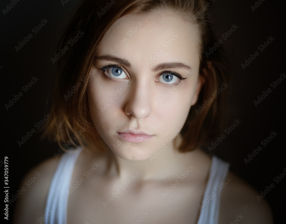 Portrait of a beautiful young woman with blue eyes. Portrait of a beautiful young woman with blue eyes.