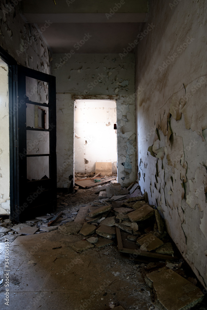 Interior of an old abandoned corridor of a deserted hospita