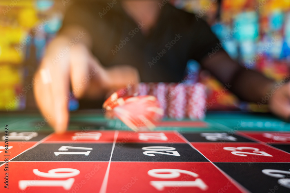 Fototapeta premium Man playing roulette at the casino