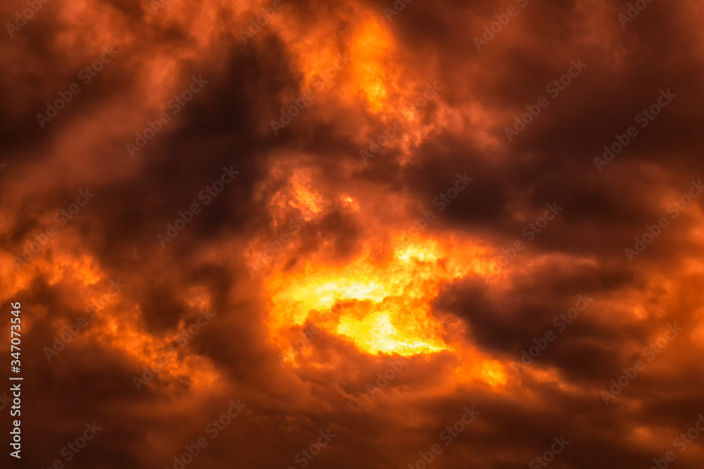 dramatic dark sky with red and orange light