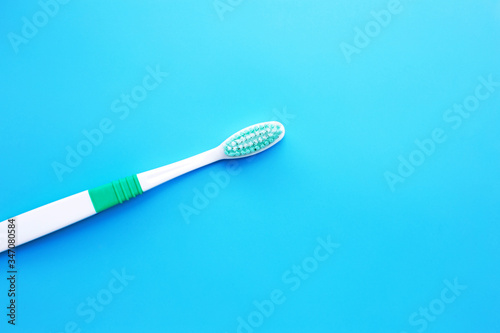 Top view of Toothbrush on blue background.