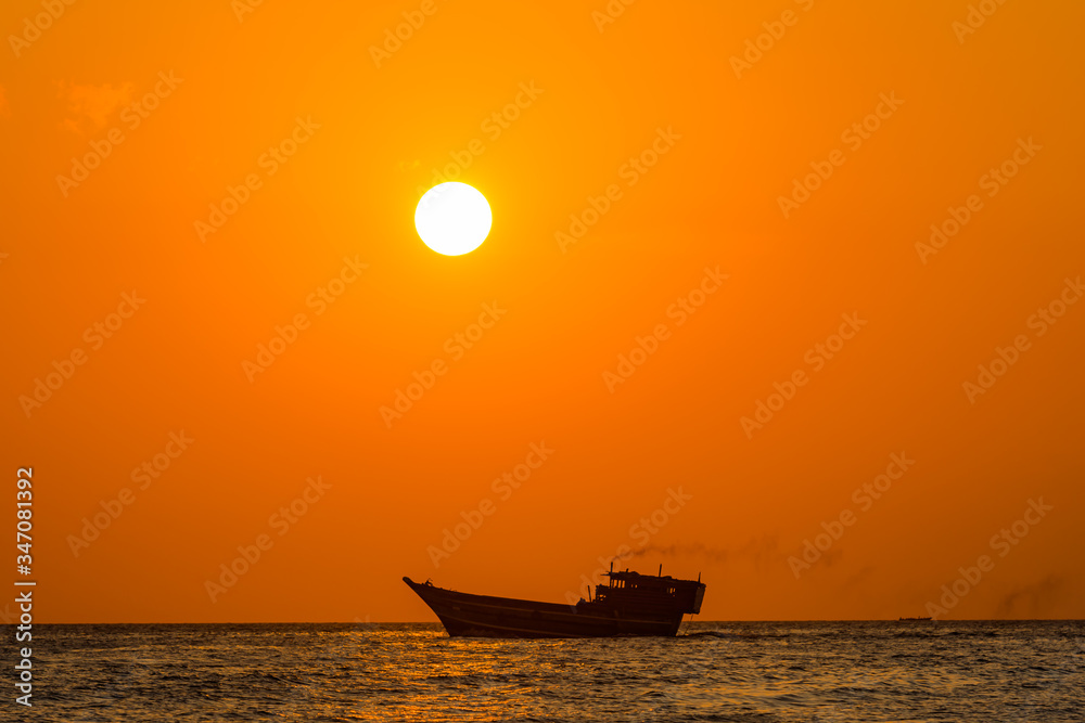 This was taken in the islands of Zanzibar at sun set. The sun was setting on the mainland side of Tanzania