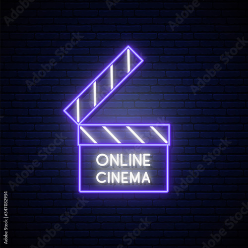 Neon Movie Clapper sign. Online movie bright emblem in neon style. Stock vector illustration.