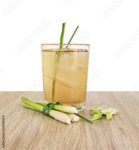 Cold lemongrass tea on a wooden table, free space