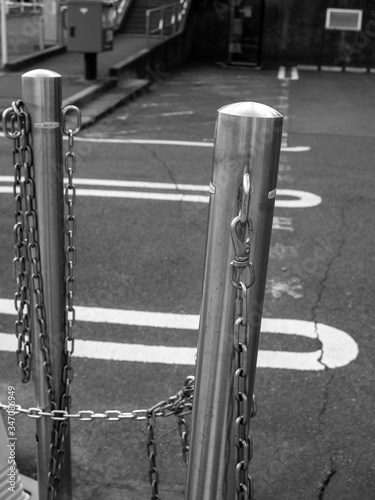 stopping pole in parking lot in black and white