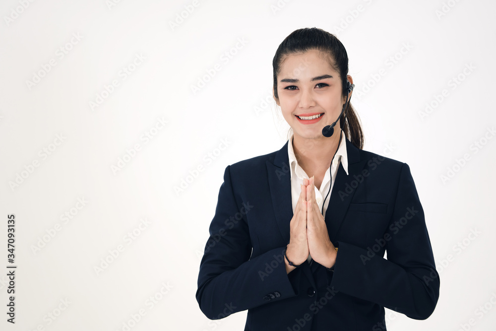 Young business smile asian woman wear headphone and greeting gesture for support. Young business smile asian woman wear headphone and greeting gesture for support.