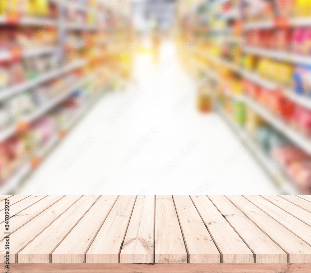 Wood table or wood floor with supermarket blur background for Product display Wood table or wood floor with supermarket blur background for Product display