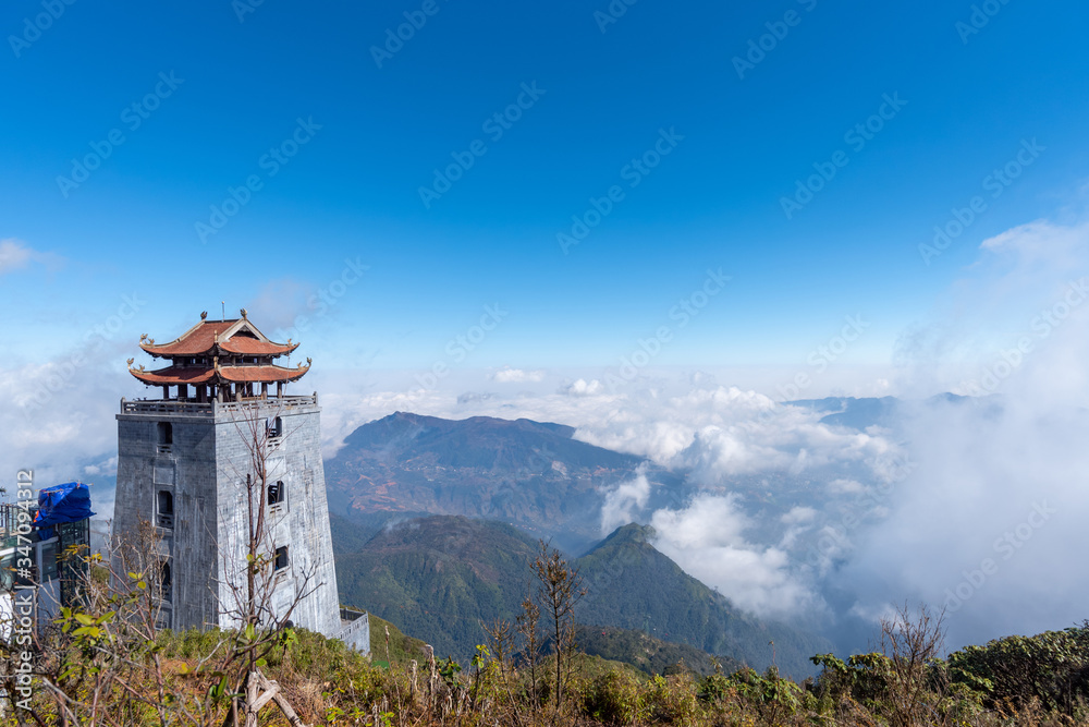 landscape view at Fansipan peak mountain, there are temple and buddha statue on the top famous place for travel in Sapa city, Vietnam. landscape view at Fansipan peak mountain, there are temple and buddha statue on the top famous place for travel in Sapa city, Vietnam.
