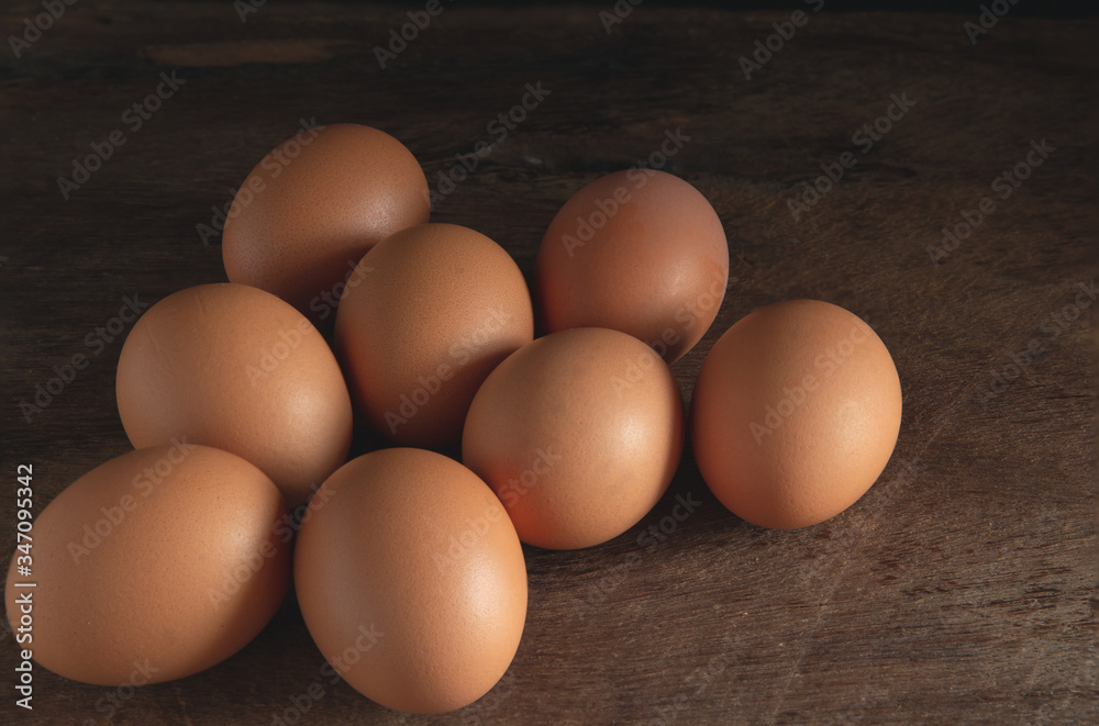 chicken eggs on wooden table background, eggs with copy space concept.
chicken eggs on wooden table background, eggs with copy space concept.