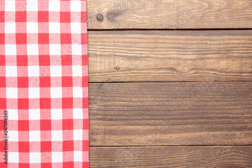 Rustic wooden and red checkeredbackground.