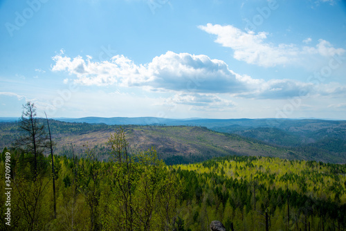 Mountain landscape.Magnificent panoramic view of the forest and beautiful blue sky. The beauty of wild virgin nature. peace