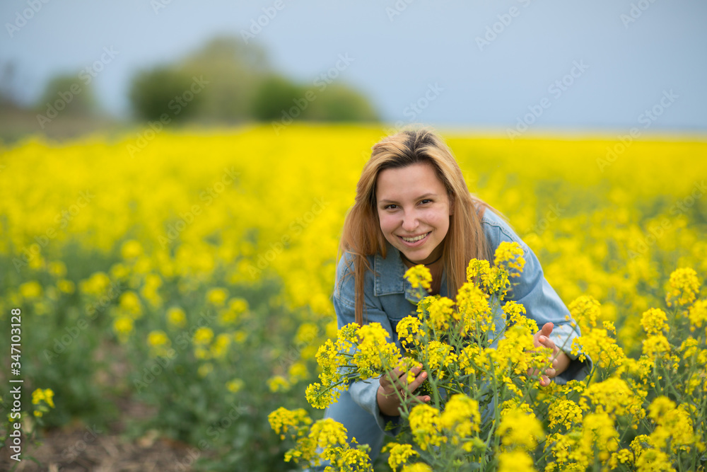 beautiful young woman on flower field beautiful young woman on flower field