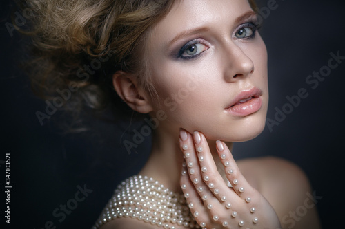 portrait of a young woman with pearls
