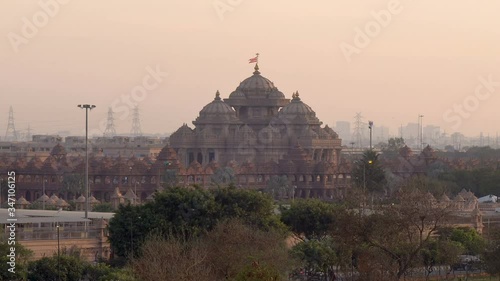 Akshardham Hindu temple in Delhi Sunset Timelapse - Famous Travel Holiday Landmark Historic Attraction in India photo