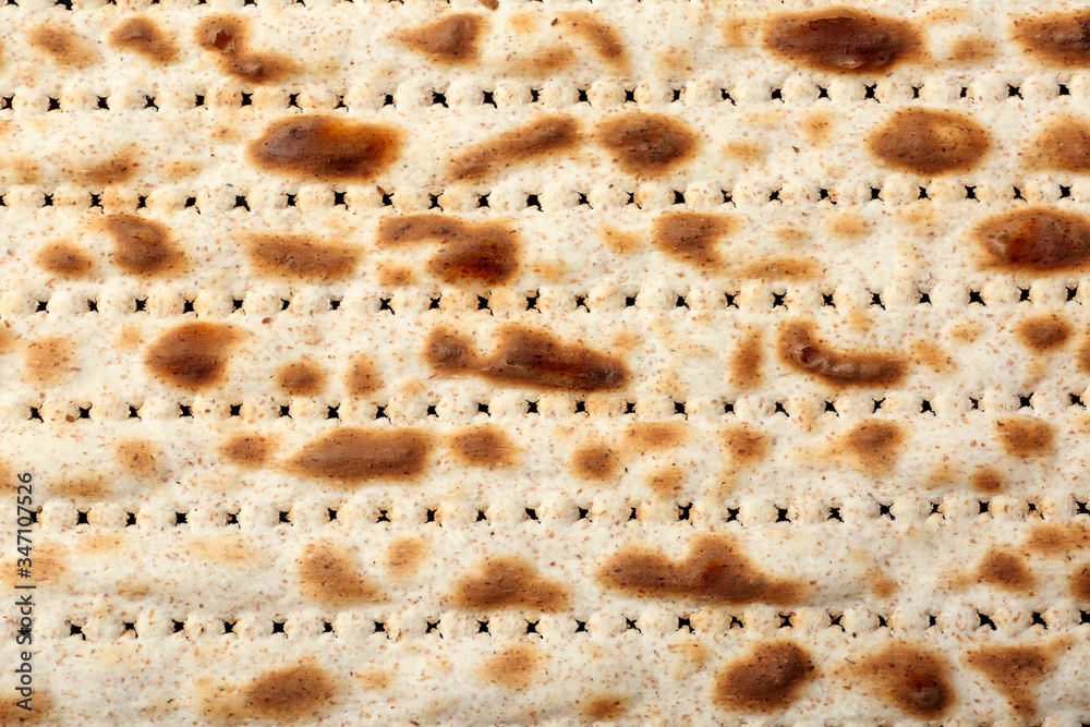 Traditional Matzo as background, top view. Pesach (Passover) celebration