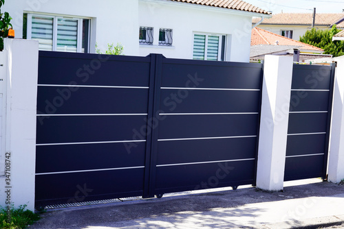 Aluminum dark gray paint metal gate house portal of suburb home door