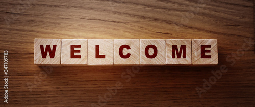 Wooden Blocks with the text Welcome. Congradulation newcomers concept