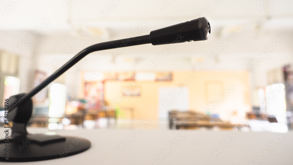 Black small miles Placed sideways to the right On the white desk in the training room there is a copy space concept, communication equipment