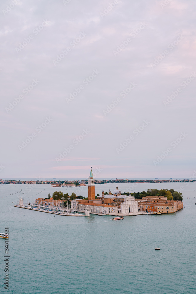 Aerial view from huge cathedral bell tower San Marco Campanile on San Giorgio Maggiore is one of the most famous islands of the Venetian lagoon, in northern Italy.