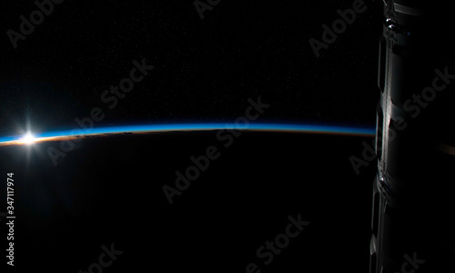 Fototapeta Naklejka Na Ścianę i Meble -  View of planet Earth horizon from a space station window during a sunrise 3D rendering elements of this image furnished by NASA