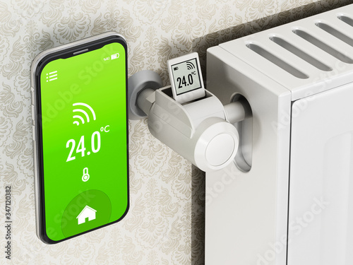 Smartphone and thermostatic radiator valve with LCD screen. 3D illustration photo