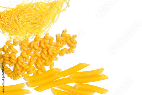 Different types of pasta laid on a light background. Healthy eating, Italian traditional kitchen concept.