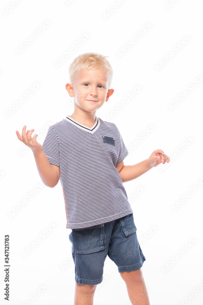 Portrait of a handsome blond boy. European handsome boy dancing on a white background. Portrait of a handsome blond boy. European handsome boy dancing on a white background.