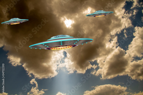 Photography A metal and silver UFO invasion of planet Earth, a group of spaceships fly in the sky