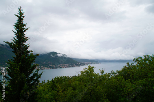 Storm clouds cover the mountains and the sea of the Bay of Kotor