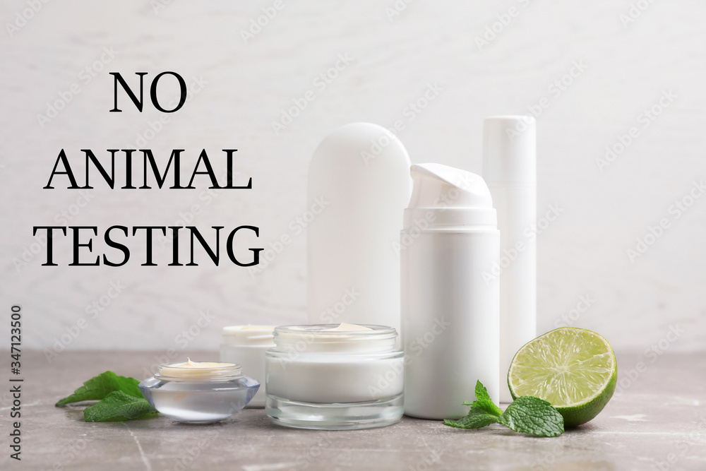 Cosmetic products and text NO ANIMAL TESTING on light background