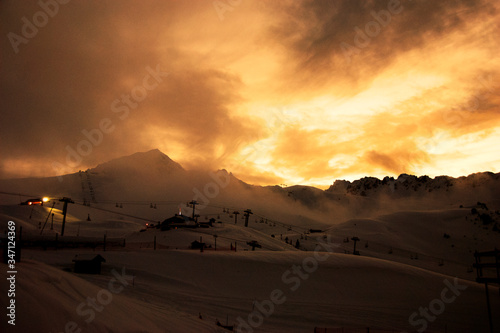 Sun setting over Les Arcs 2000 paradiski ski area Massif de La Vanoise  high Tarentaise valley Savoie France