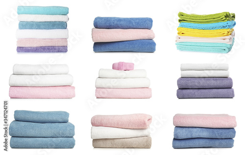 Set of folded soft terry towels on white background