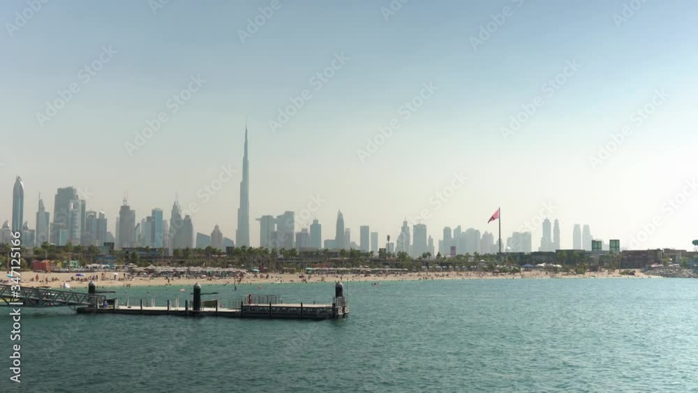 Static view of popular La Mer Beach in Dubai, United Arab Emirates; Modern Dubai skyline background. Static view of popular La Mer Beach in Dubai, United Arab Emirates; Modern Dubai skyline background.
