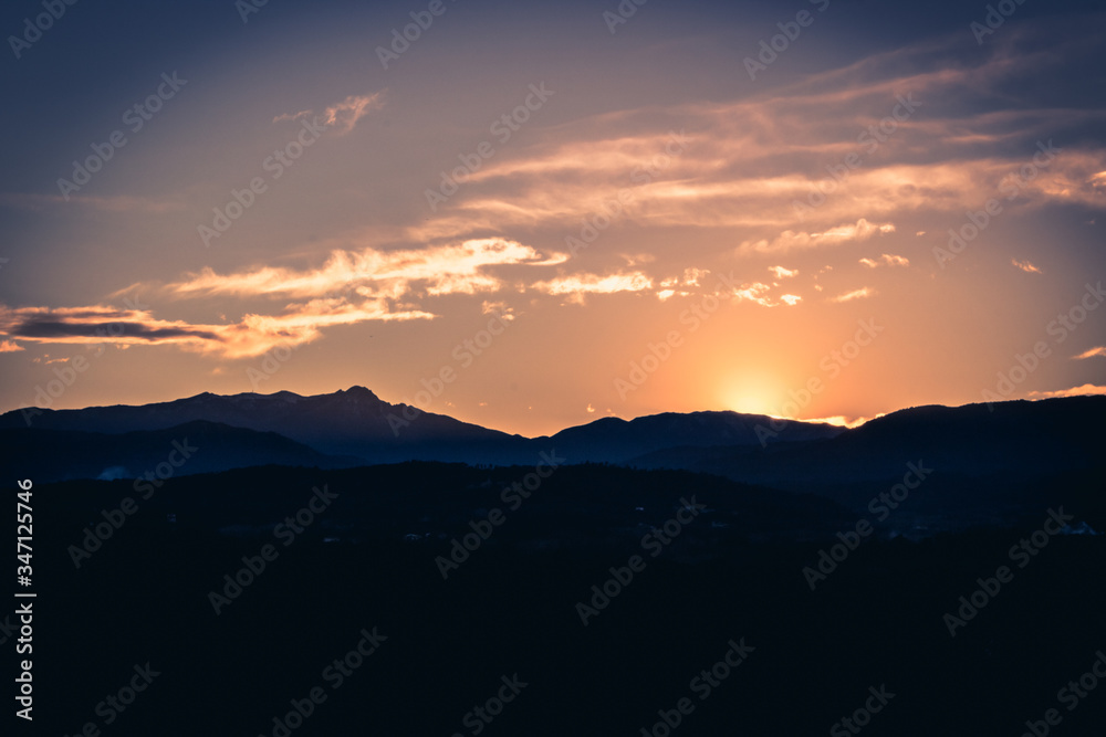 golden sunset behind the mountains golden sunset behind the mountains