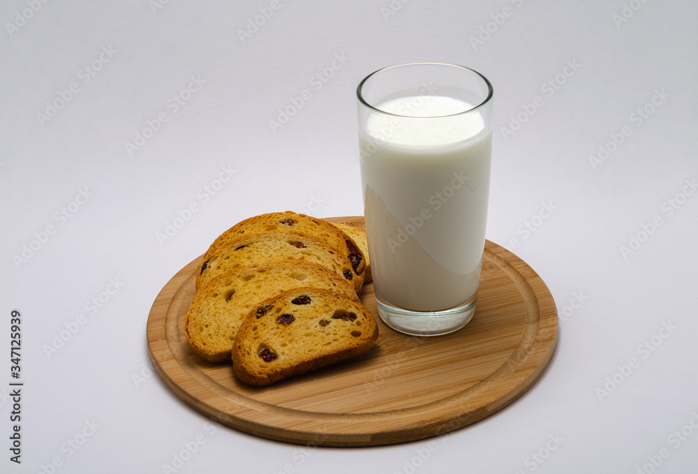 baked goods, crackers with raisins, crackers, crispy and a glass of milk baked goods, crackers with raisins, crackers, crispy and a glass of milk