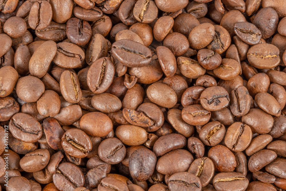 Roasted coffee beans top view. Great for texture and print. Roasted coffee beans top view. Great for texture and print.