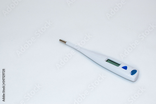 Digital thermometer closeup on white background