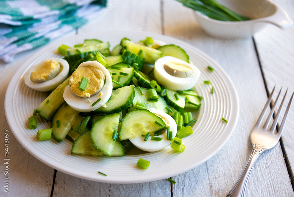 Healthy green salad with cucumbers, eggs and onions Healthy green salad with cucumbers, eggs and onions