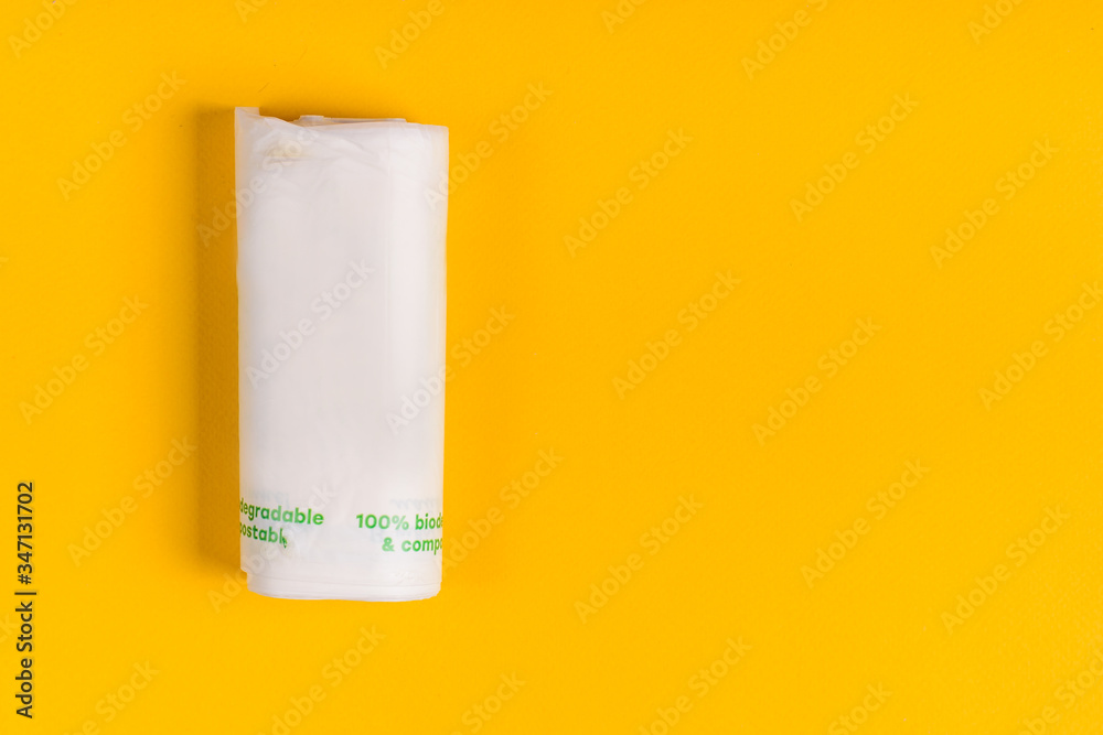 Biodegradable package isolated on the yellow backround. Eco friendly. Biodegradable package isolated on the yellow backround. Eco friendly.