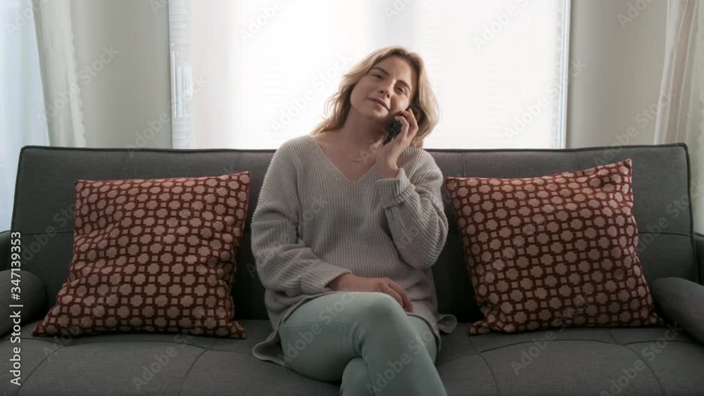 Gorgeous young blonde girl talking on a cell phone