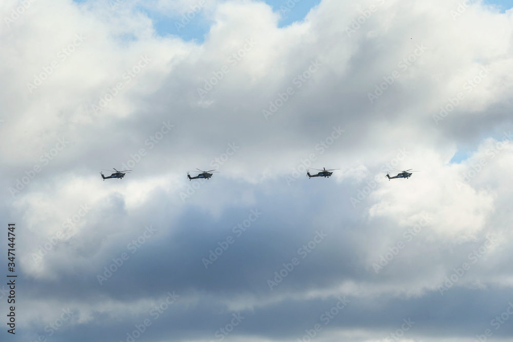 From bellow Group military helicopters in the sky From bellow Group military helicopters in the sky
