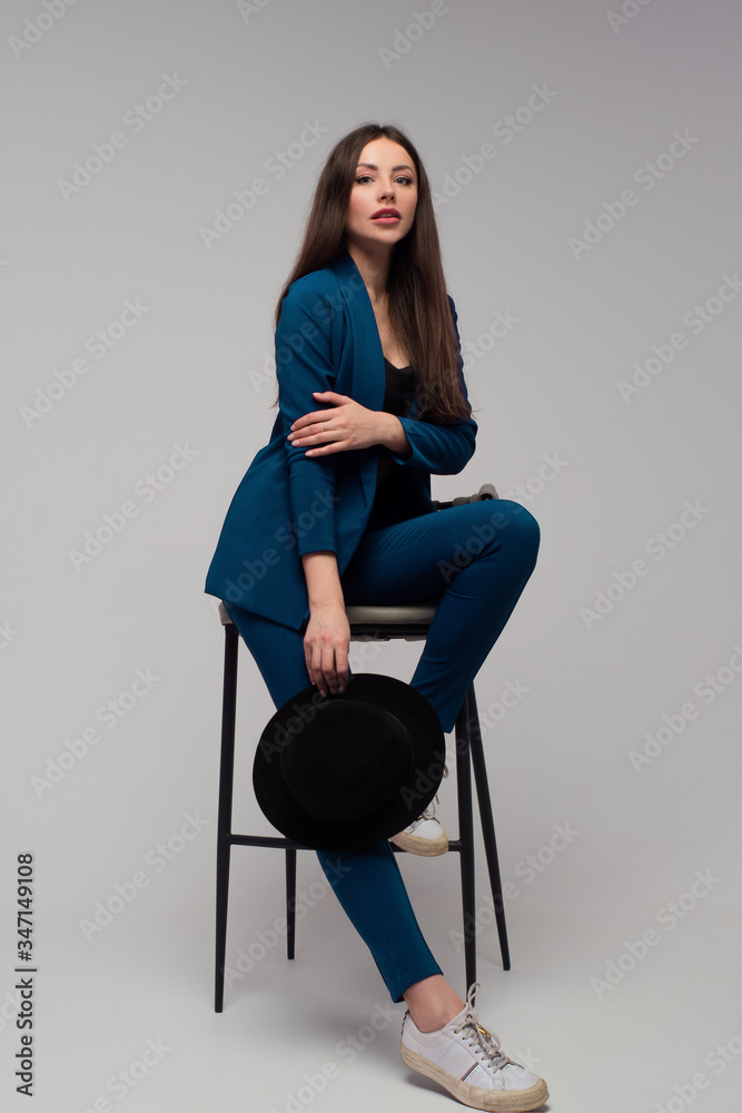 stylish business woman in a dark blue pantsuit. stylish business woman in a dark blue pantsuit.