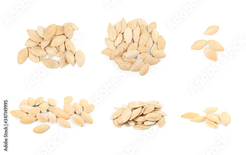 Set of raw pumpkin seeds on white background