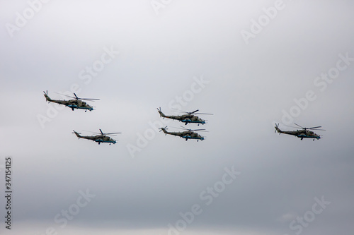 Combat helicopters fly to the May 9 parade