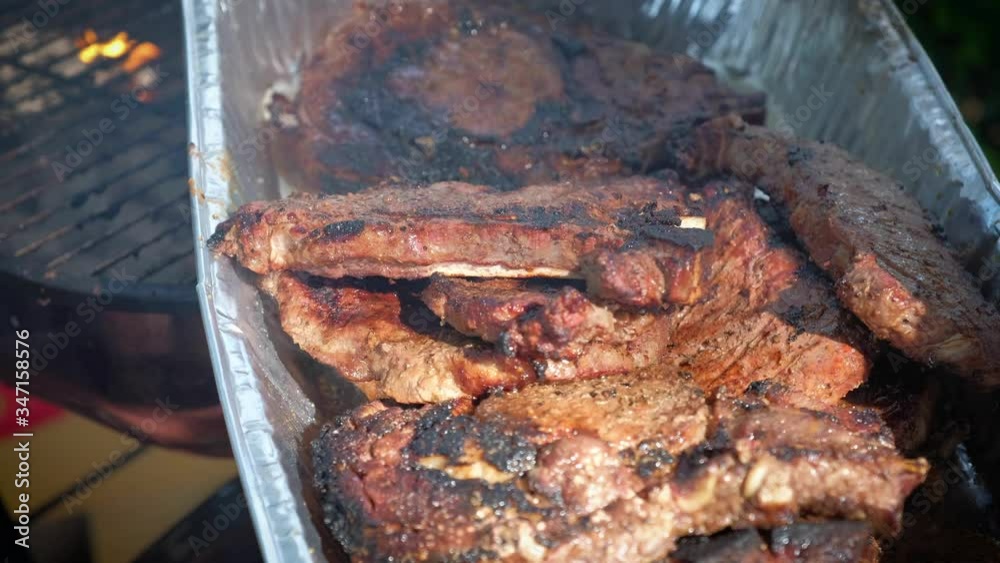 4K, Grilling steaks on a charcoal barbecue in garden, 4K footage, 4K, Grilling steaks on a charcoal barbecue in garden, 4K footage,