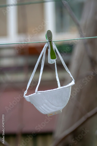 Protective N95 surgical medical mask.

White medical mask. Protection from virus, corona virus, flu, ebola, air pollution. Health care and surgical concept.