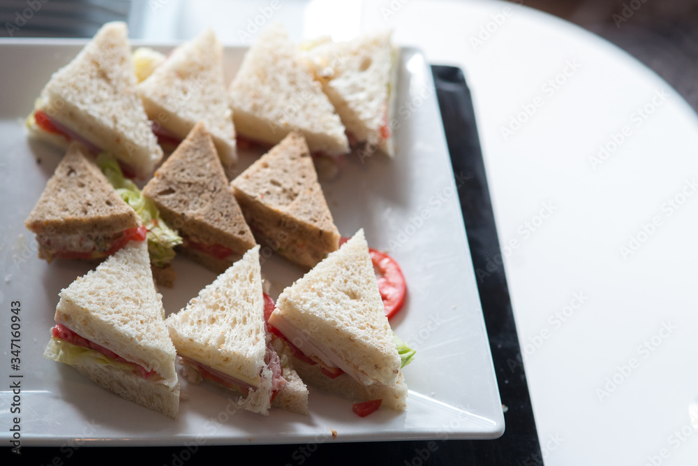 Hotel Coffee break  cold cut platter ham cheese sandwich triangles