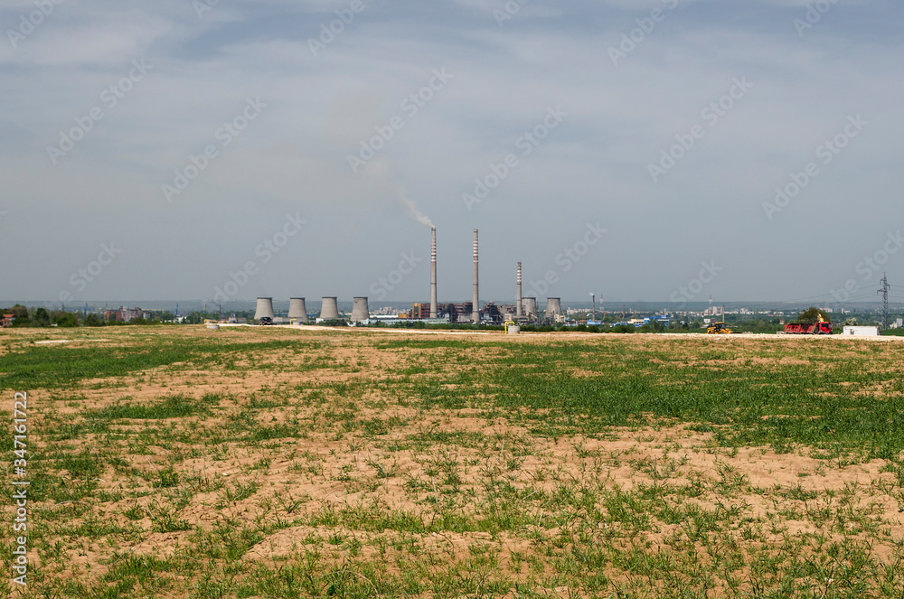 Coal Power Plant Smoking and Steaming against Blue sky Coal Power Plant Smoking and Steaming against Blue sky