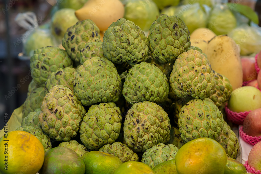 Pile of custard apple in market Pile of custard apple in market