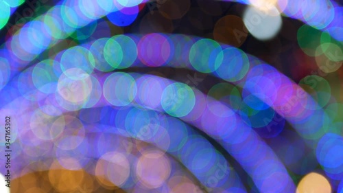 Bokeh background of colorful festive light turnel at night time